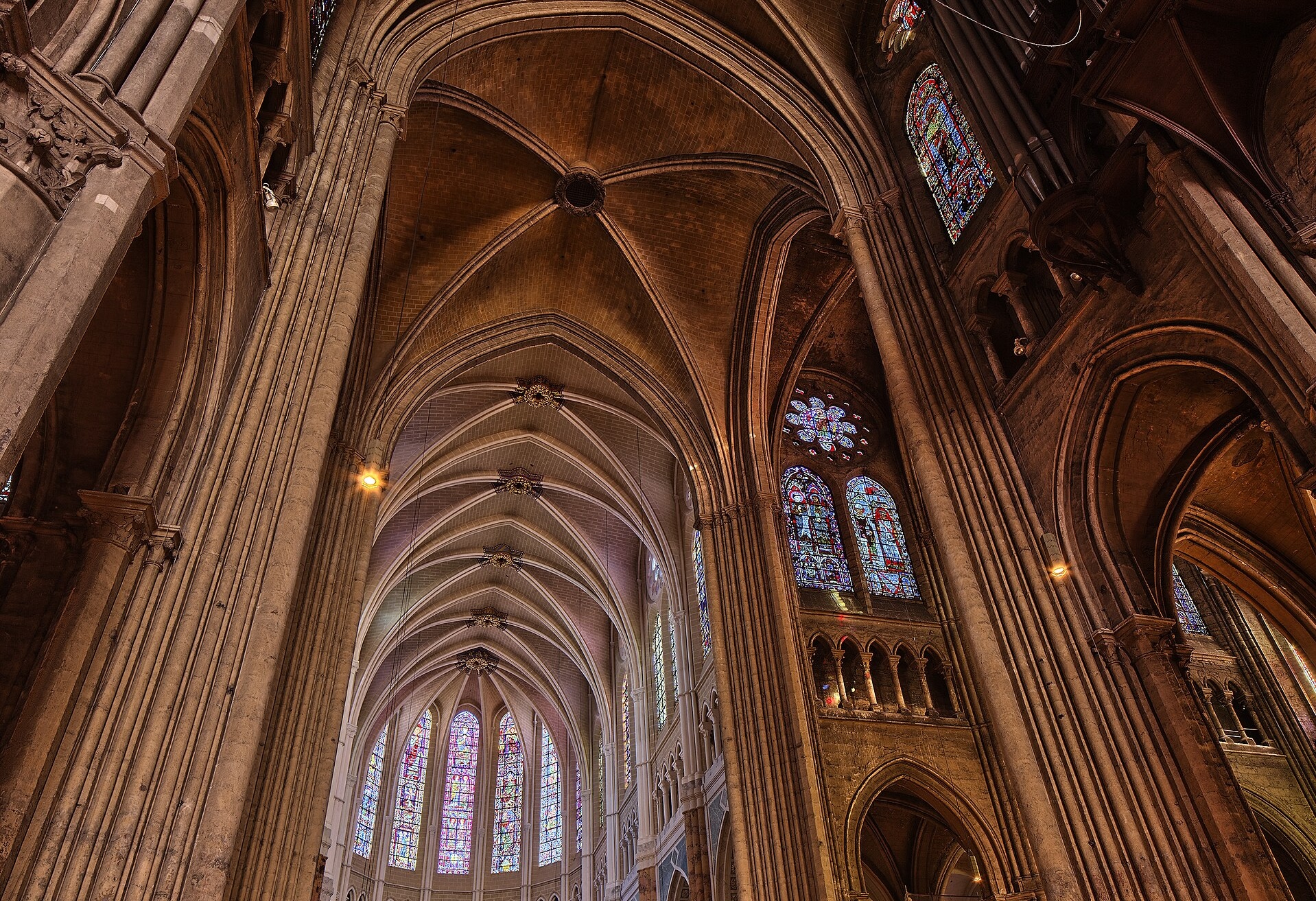  A photograph taken at an upward angle of the vaulted ceiling of Chartres Cathedral.